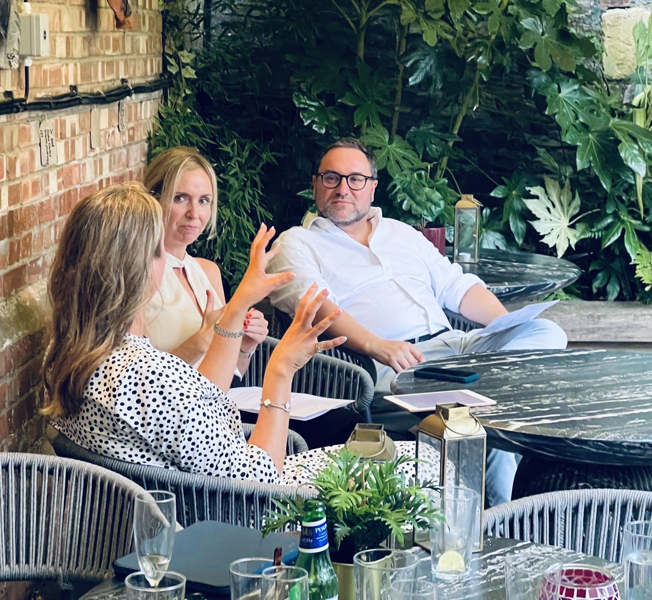 Intimate roundtable discussion in a garden setting